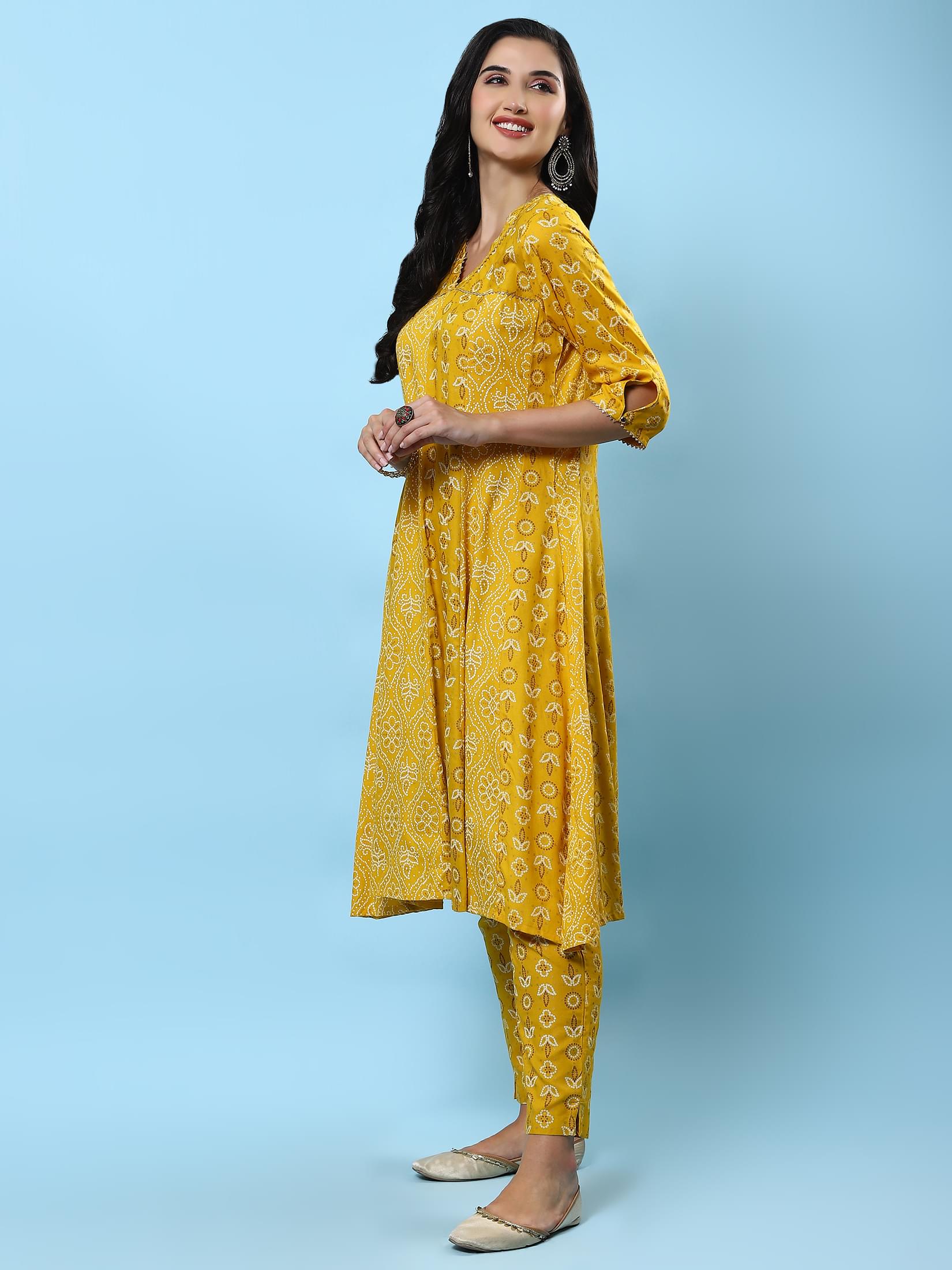 Women Mustard Ornamental Printed Kurta With Trouser.