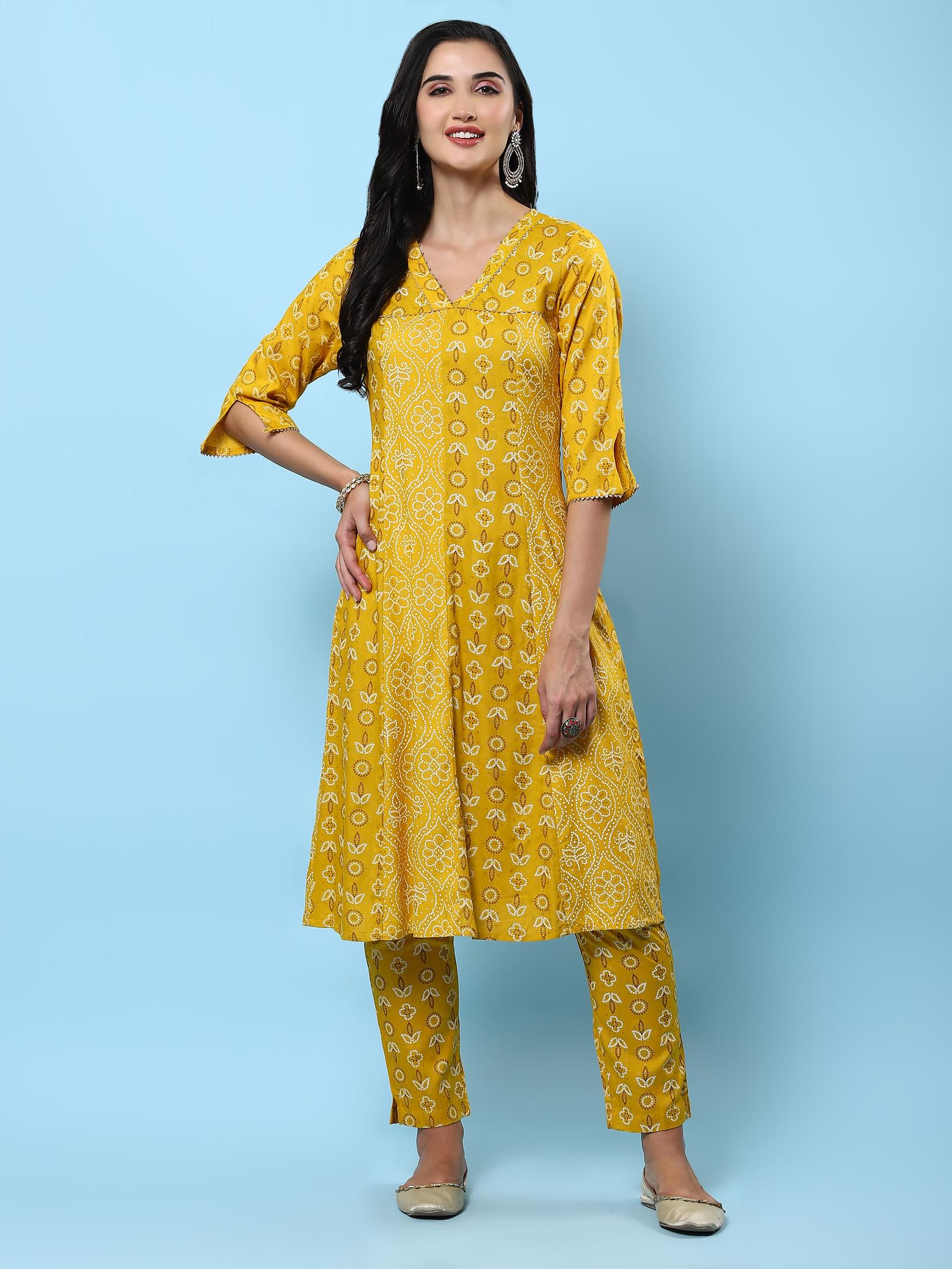 Women Mustard Ornamental Printed Kurta With Trouser.