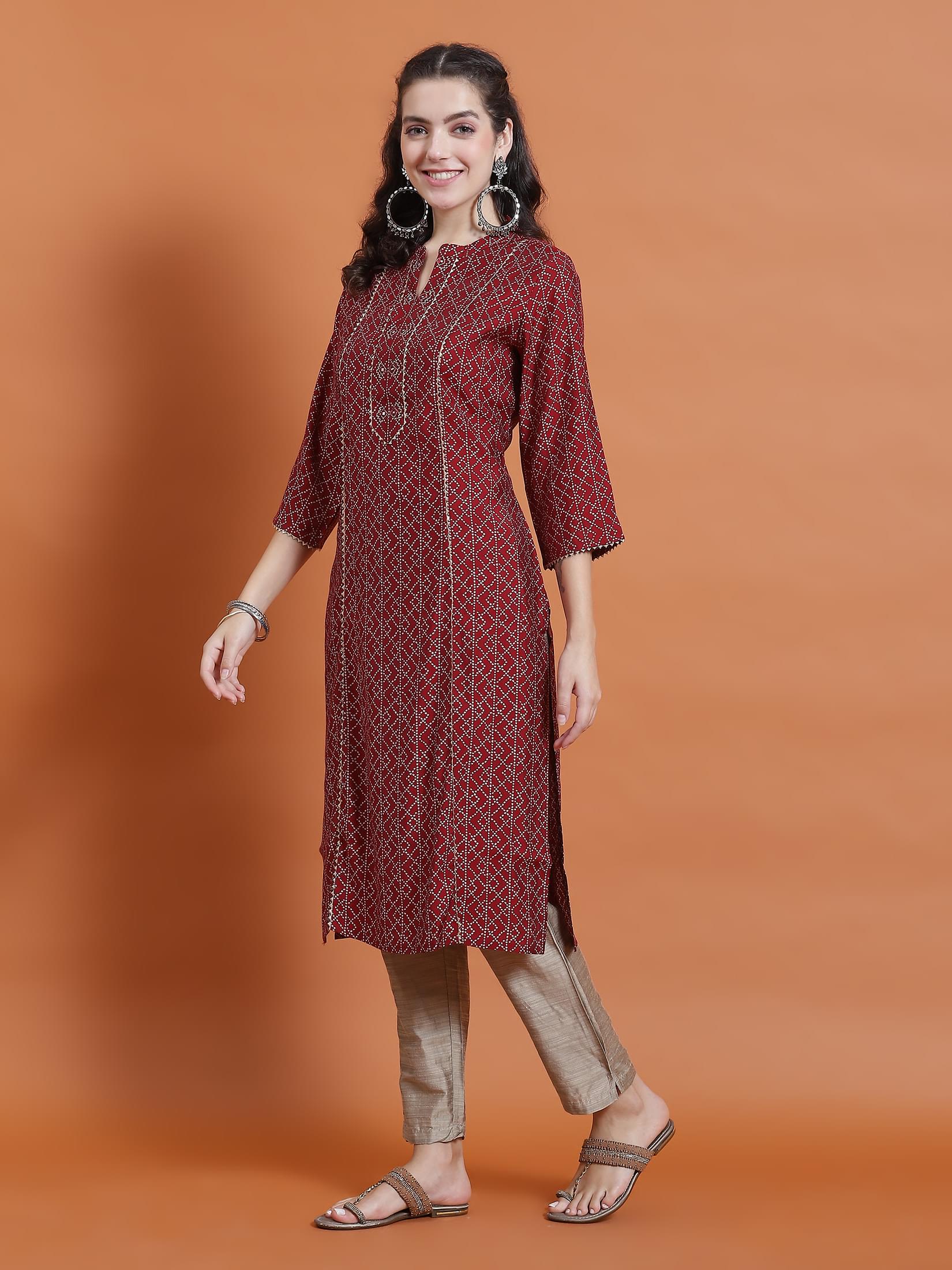 Women Maroon Geometric Print Kurta With Trouser.