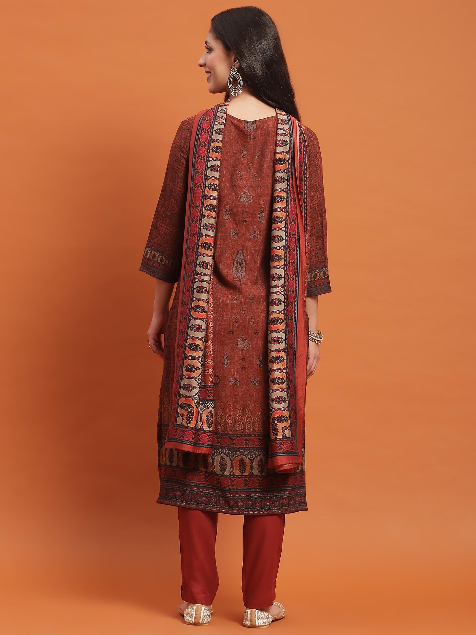 Women Rust Ornamental Print Kurta Trouser Dupatta.