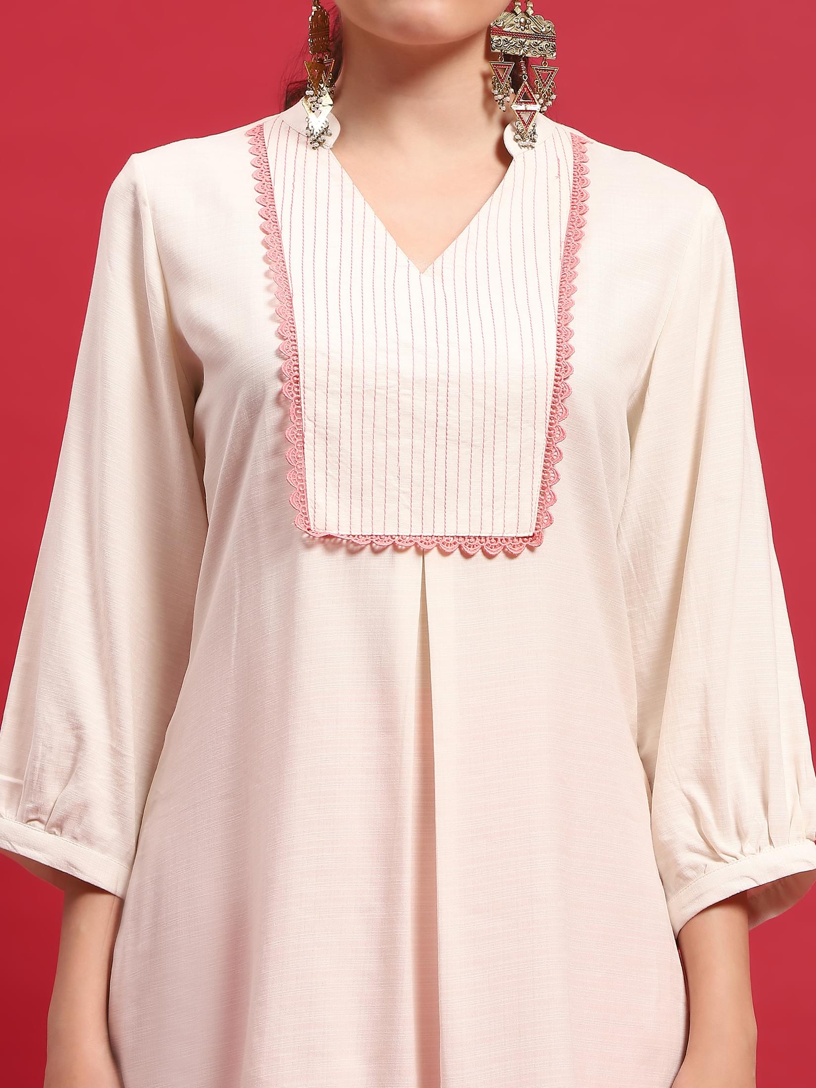 Women Liva Rayon Cream Solid Kurta With Trouser.