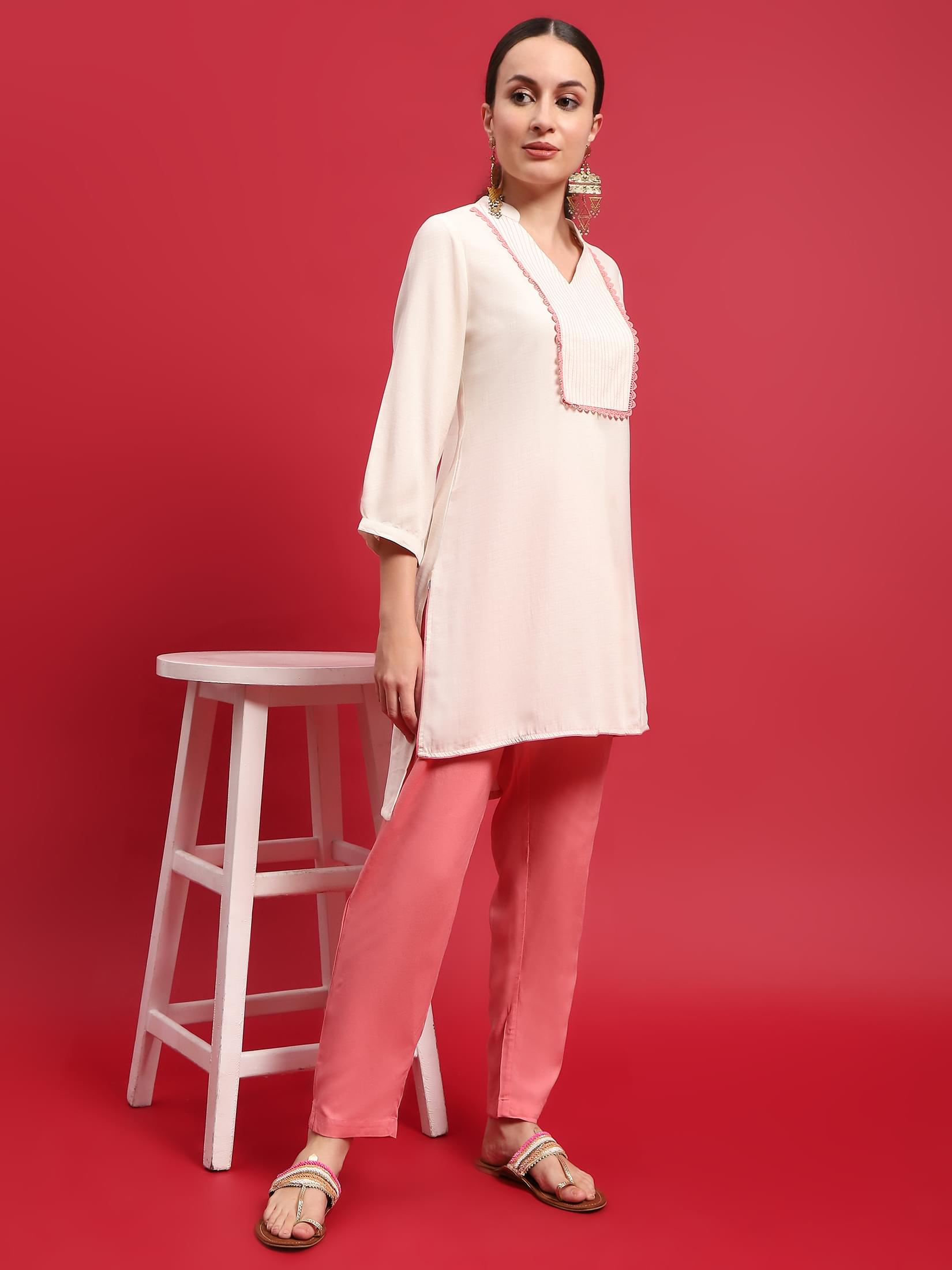 Women Liva Rayon Cream Solid Kurta With Trouser.