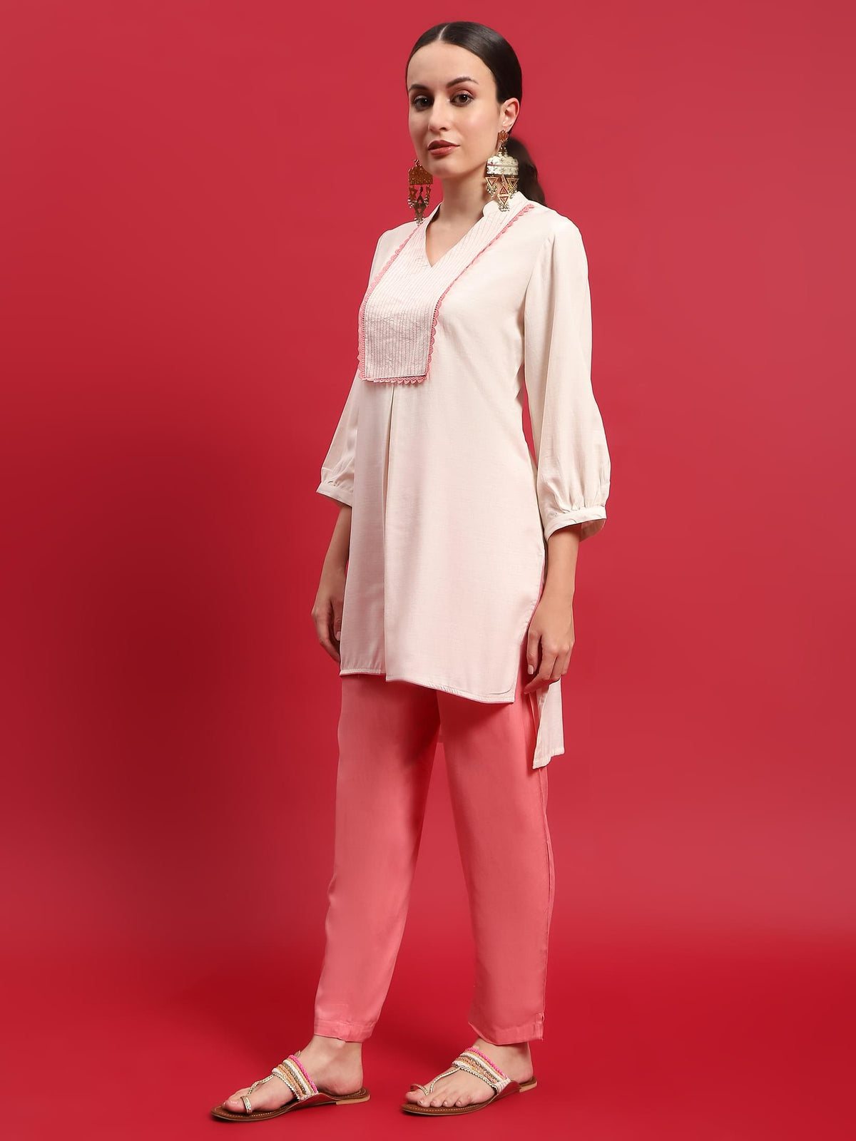 Women Liva Rayon Cream Solid Kurta With Trouser.
