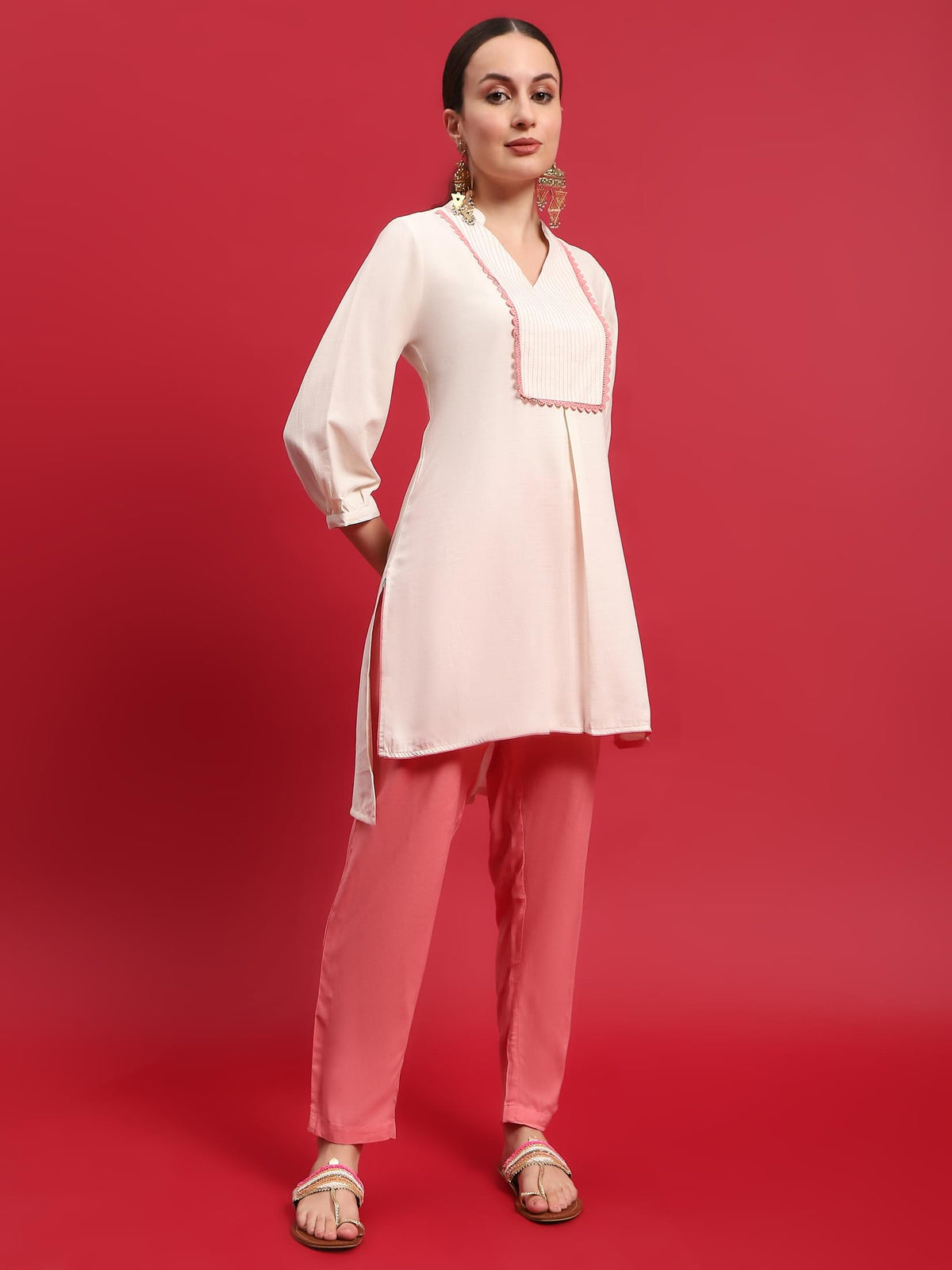Women Liva Rayon Cream Solid Kurta With Trouser.