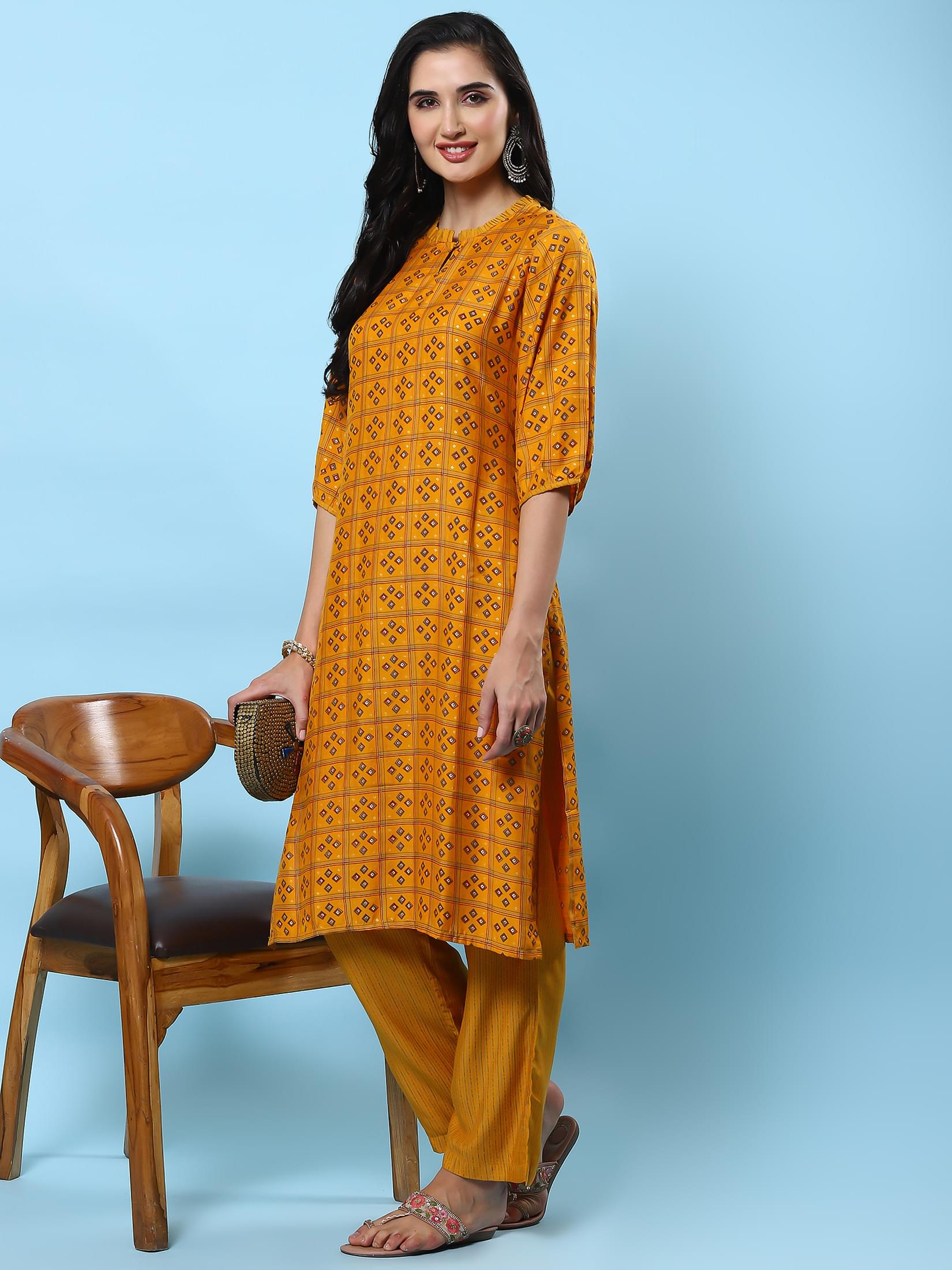 Women Mustard Geometric Printed Kurta With Comfort Pant.