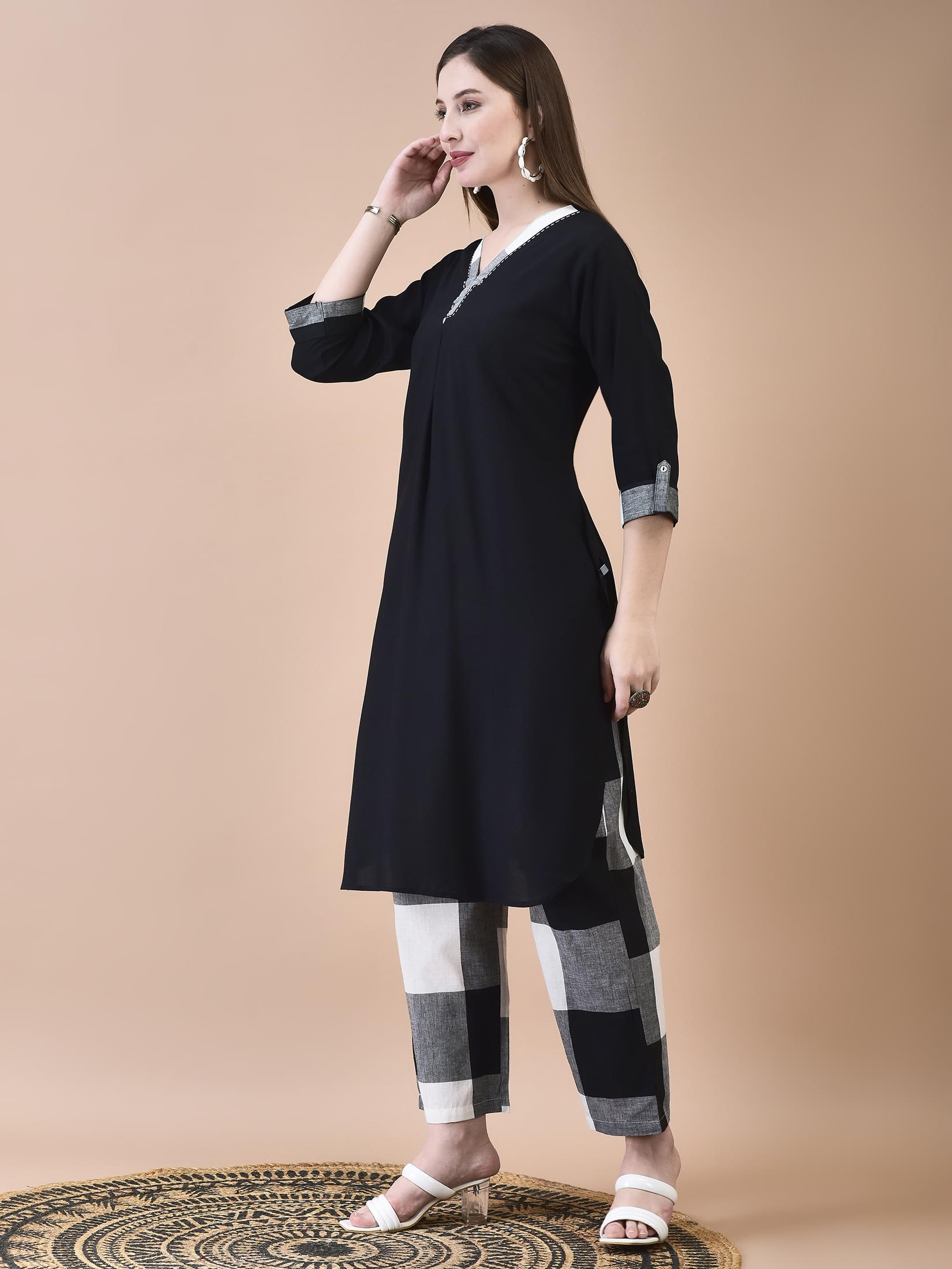 Women Liva (Rayon) Black Solid Kurta With Cotton Comfort Pant.