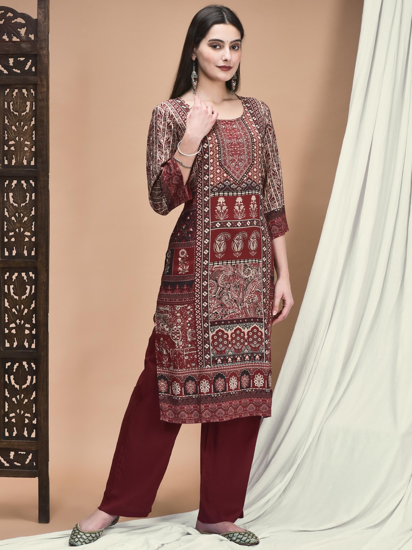 Women Liva Maroon Ornamental Print Kurta With Comfort Pant.
