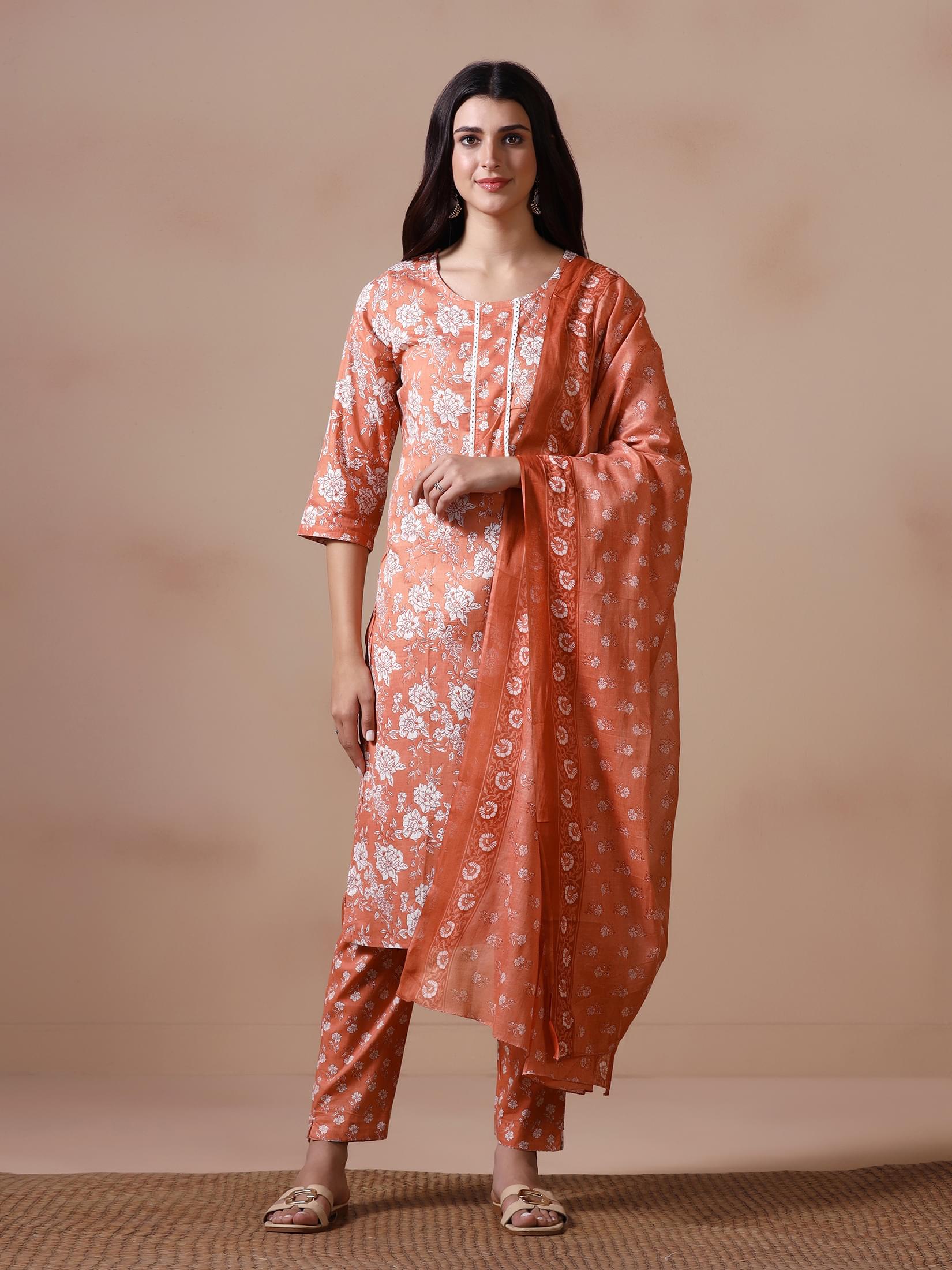 Women Cotton Peach Floral Print KurtaTrouser Dupatta.