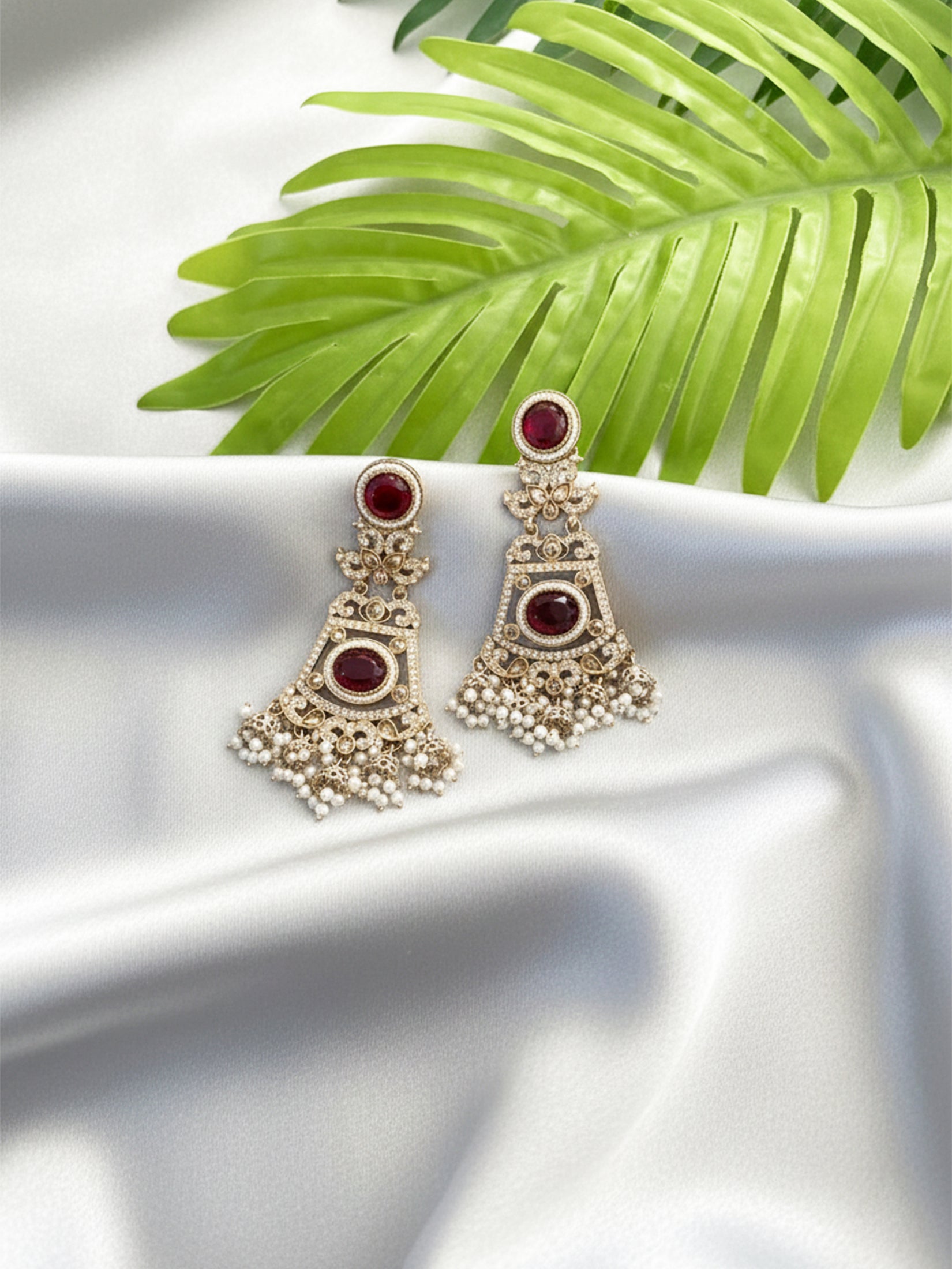 Intricate Kundan Jhumkas With Maroon Stones