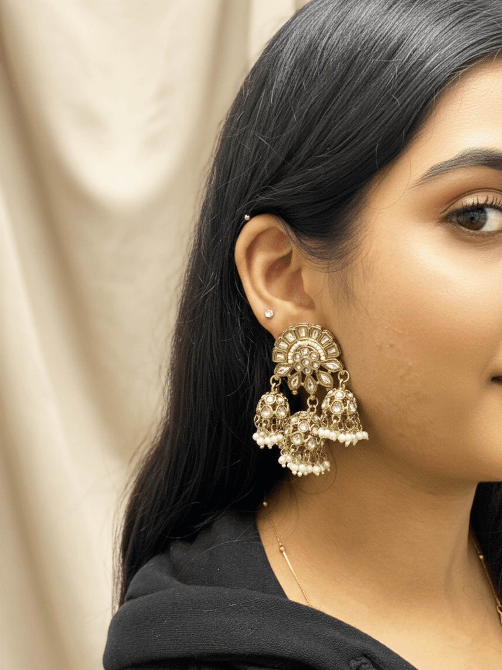 Traditional antique gold plated dangler earrings decorated with small jhumkas