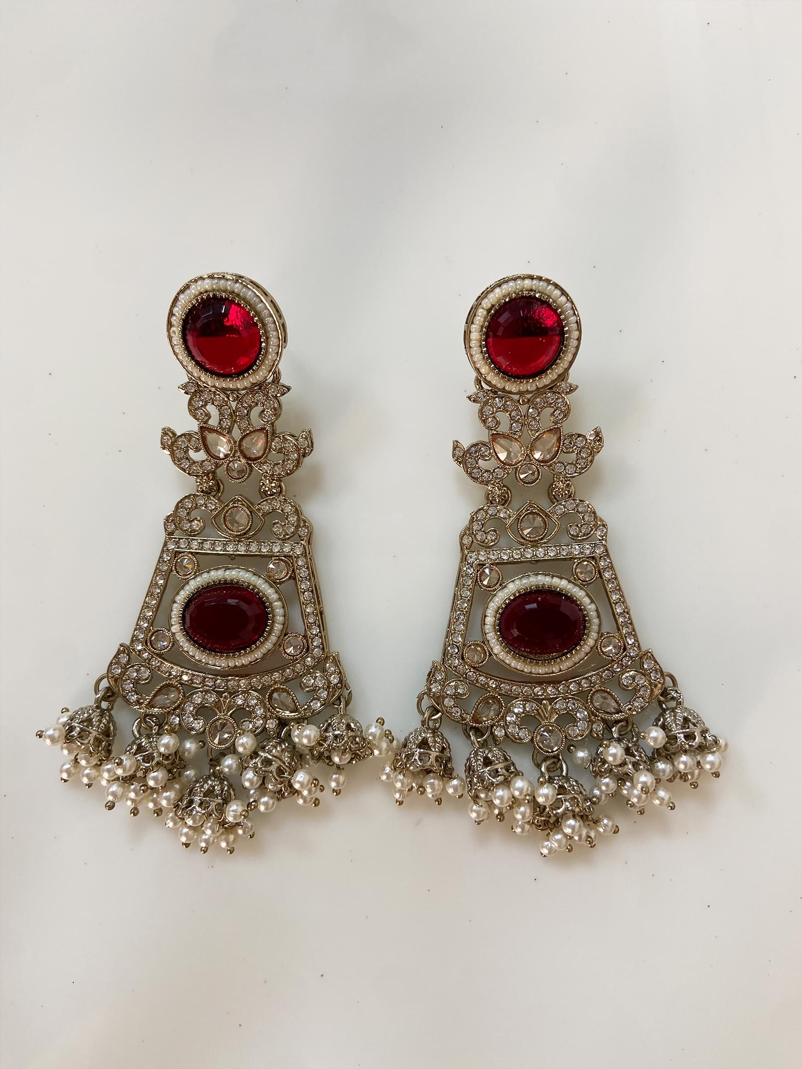 Intricate Kundan Jhumkas With Maroon Stones.