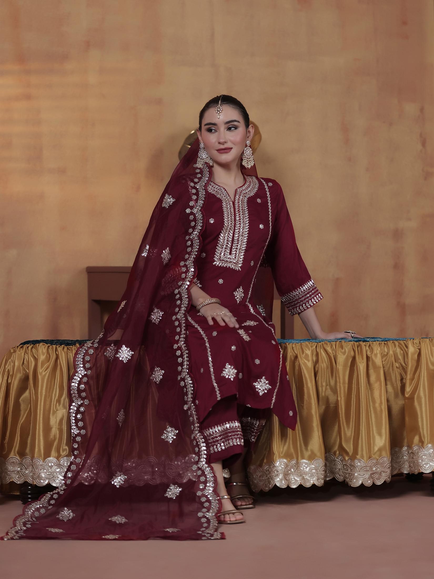 Deep maroon embroidered silk blend straight kurta paired with comfort pants byshree