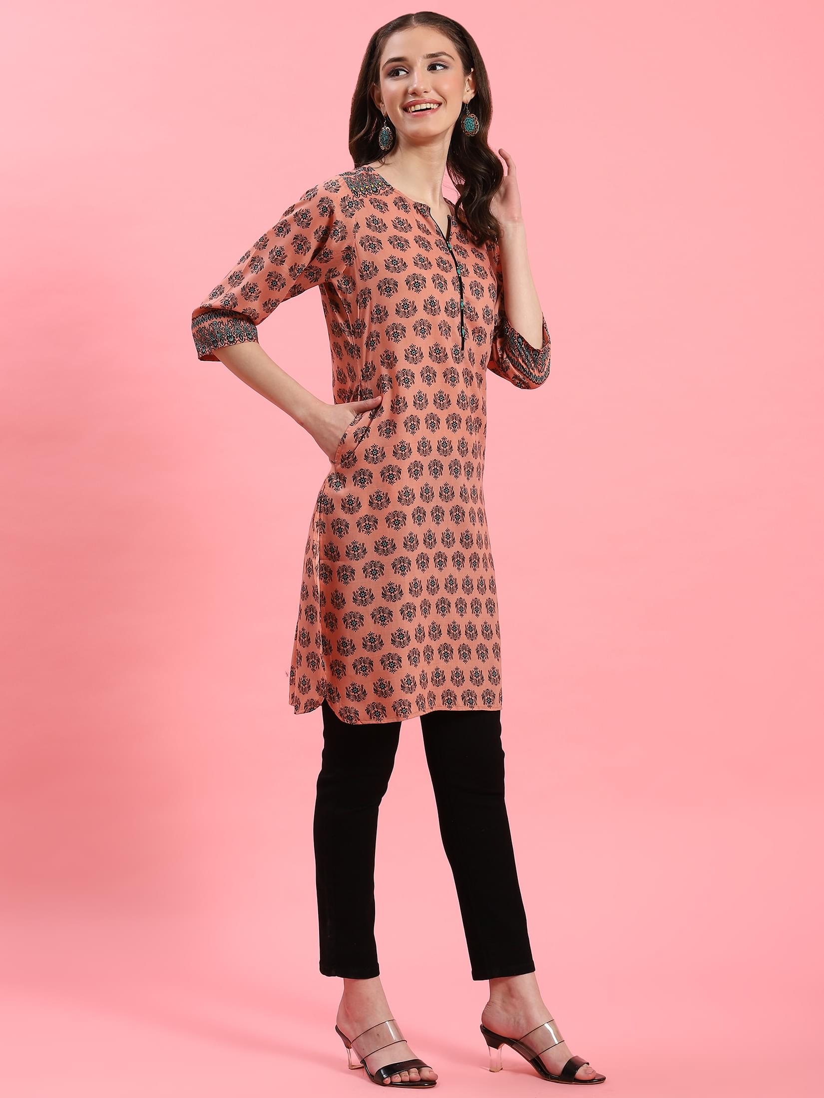 Women Peach Ornamental Printed Kurti.