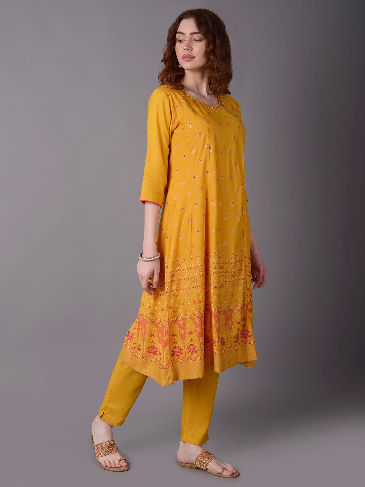 Women Mustard Ornamental Printed Kurta With Trouser.