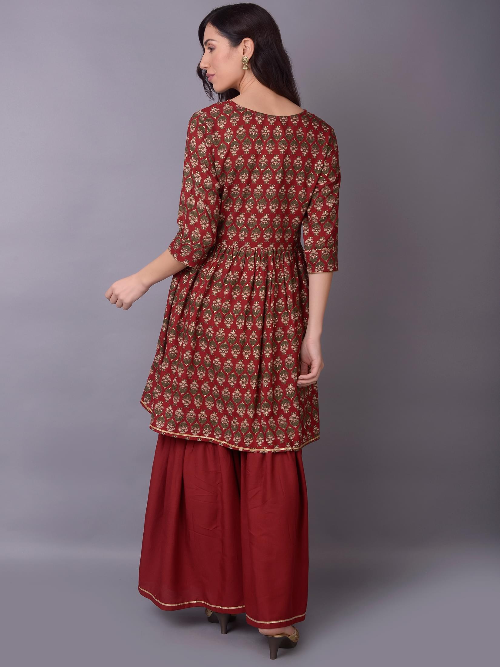Women Maroon Ornamental Printed Kurta With Sharara Pant.