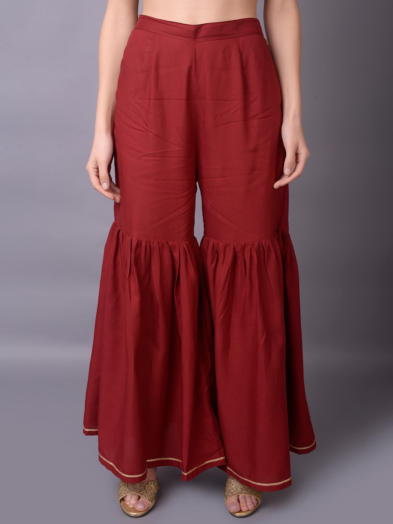 Women Maroon Ornamental Printed Kurta With Sharara Pant.