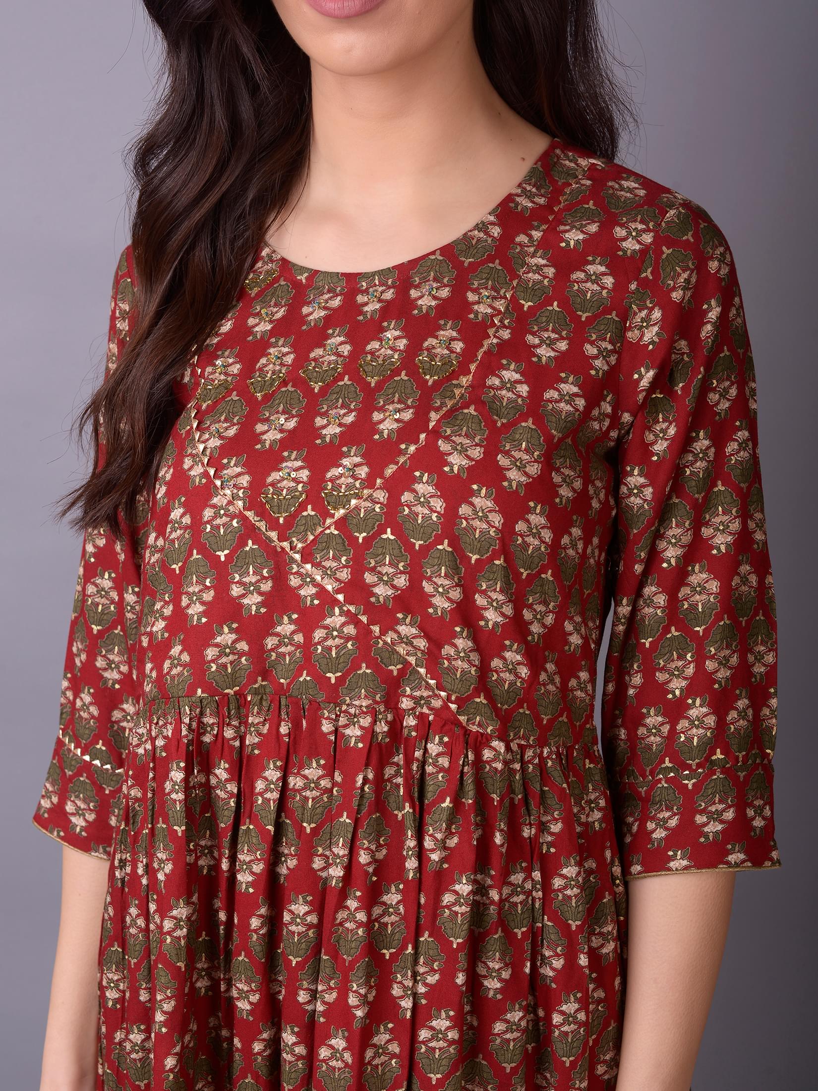 Women Maroon Ornamental Printed Kurta With Sharara Pant.